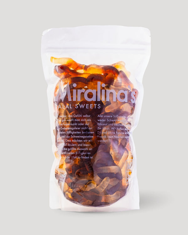 Eine Packung Miralina's Halal Sweets gefüllt mit bernsteinfarbenen und orangefarbenen Fruchtgummis